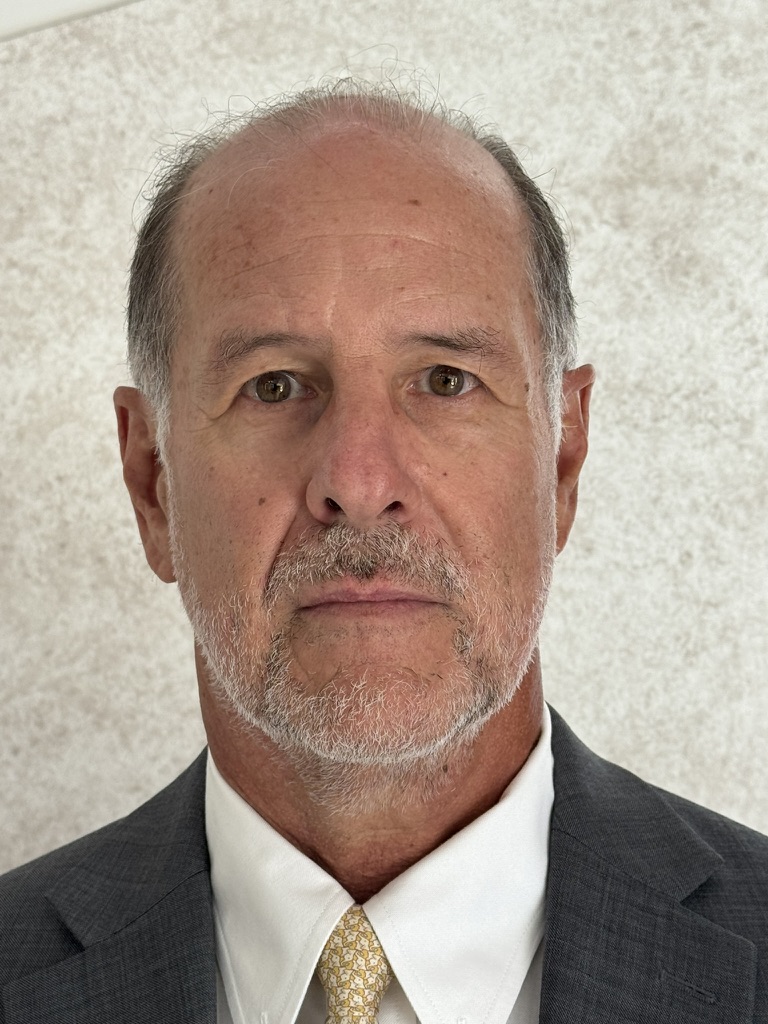 Joaquin Garza Muguerza in a dark suit and patterned tie